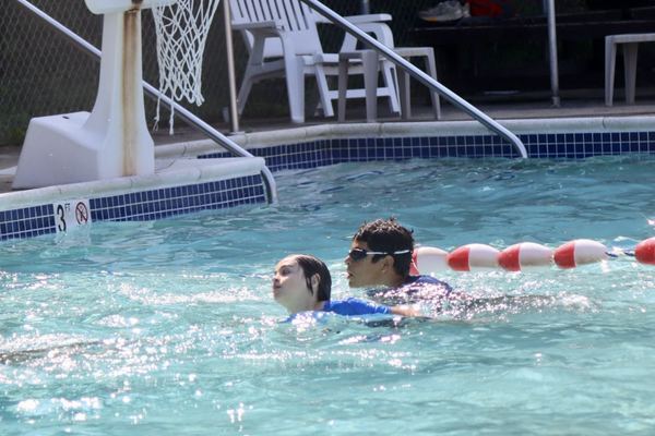 Swimmers in the camp pool