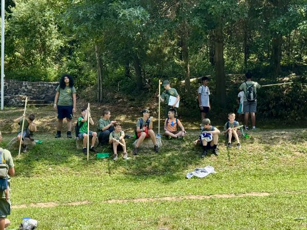 Scouts gathered on the field at summer camp