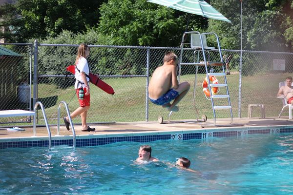 A scout leaps into the pool
