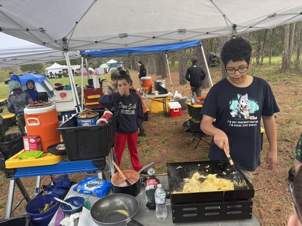 Patrol cooking breakfast at the camp kitchen
