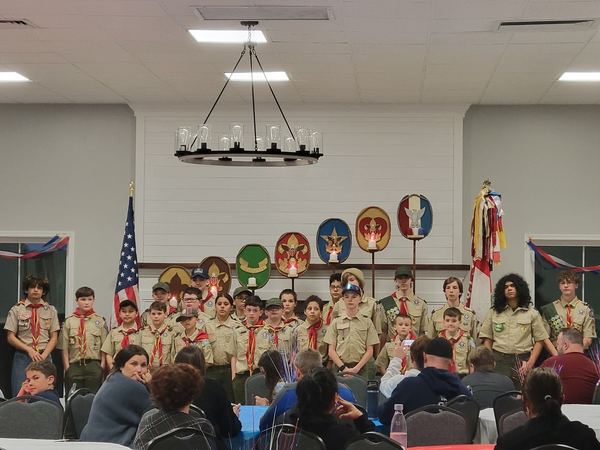 Scouts lined up on stage at the Court of Honor