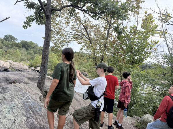Scouts on a rocky overlook during a hike